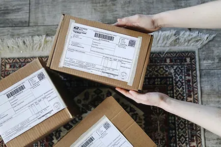A team member preparing printed materials for fulfillment and shipping